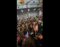 People dance party outside terminal after concert