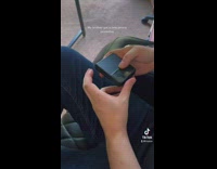 Guy plying pokemon on new phone gameboy