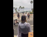 Woman poses in front of Shellback tavern
