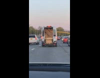 Back Door of Van Risks Spilling Wood on Freeway 