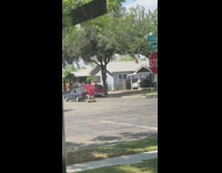 Electric toy car pulled by green car neighborhood