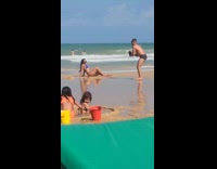 Woman blue bikini poses at the beach