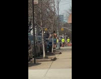 shirtless man works out jump room on sidewalk