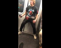 Guy black flower shirt air guitar