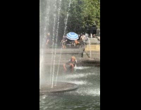 Man sitting on beach chair on fountain