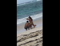 Mom Poses for Beach Photos while Son Waits 