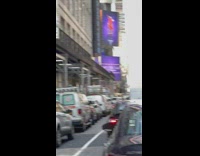 Shirtless guy does handstand on plumbing car 