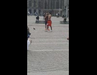 Man shirtless air punch tiktok dance park