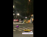 Yellow snowplow spins around on snow 