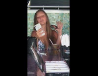 Woman white floral top selfie bar music