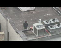 Guy on Rooftop Wears Medieval Armor 