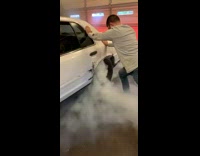 Guy in car fills garage with smoke 