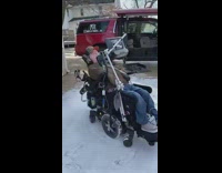 Disabled Man Goes Around in Place on Wheelchair