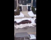 Guy uses wood to shovel snow car