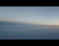 Pilot looks out airplane window earth shadow 