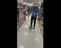 Guy play soccer in grocery hit camera