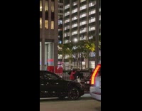 Guy ringing bells outside for holiday donations 