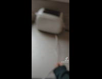 Girl grabs her white toaster says its time for bath