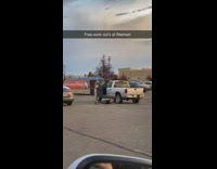 Man do push ups beside pickup truck