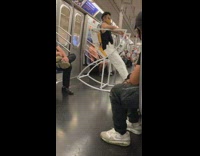 Guy sits white hourglass rocking chair subway 