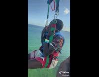 Guy passes out on paraglide over water