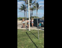 Three women twerk call man bicycle car