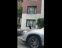 Bald guy dances for camera on sidewalk 