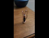 Copper Wire with Magnets Spins Around Battery