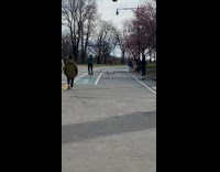 Collab WINY - Man on Unicycle Walks Dog in Park