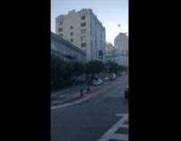 Girl sit chair middle downhill road car