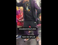 Man dancing with tongue out on subway train