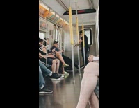 Guy wrap resistance bands around handrails and does bicep curls exercise on the train