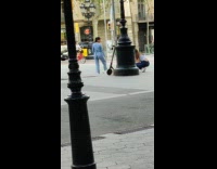 Woman blue romper pictorial lamppost street 