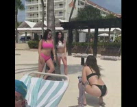 Tree between two girls beach pink bikini