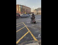 Woman drives in mobility scooter 