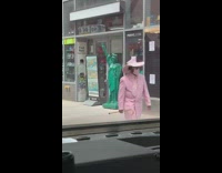 Guy pink pimp outfit face mask cane