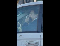 Guy in white minivan plays the flute 