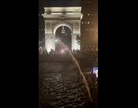 Shirtless guy rides bike at public fountain