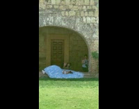 Girl blue quinceanera  lays on grass
