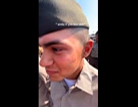 Woman tries to make soldier laugh during tap out