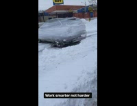 Car wrapped in saran wrap to cover from snow
