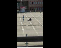 Number thirteen jacket guy sits parking lot 