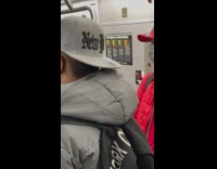 Man in subway wear NYC brand on stuff