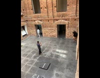 Two women poses inside the brick museum