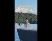 Edge of pool guy swim shorts back photo