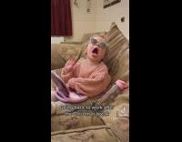 Girl toddler slams hands on toy laptop then screams