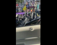 Couple dressed as batman and catwoman ride batmobile 