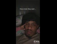 Dad laying in bed gets slapped by young daughter