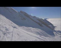 Skier does triple backflip off tall ramp and crashes into pile of snow