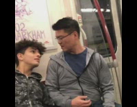kid with curly hair sleeping on man next to him